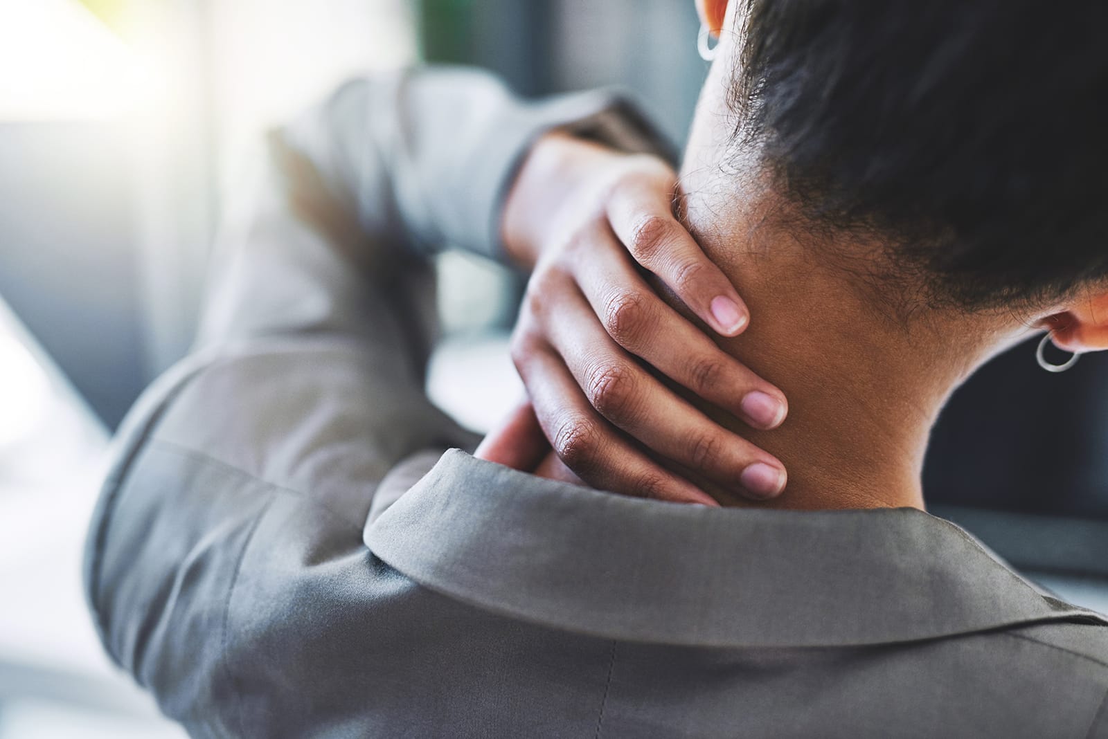 A patient experiencing pain in their neck.