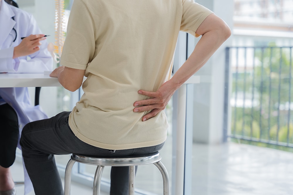 A patient seeking personalised care for back pain