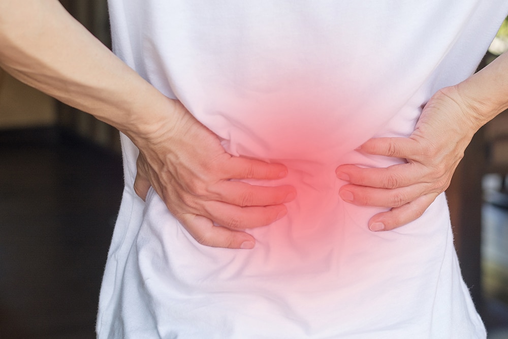 Male patient with persistent lower back pain, considering lumbar spinal stenosis surgery.
